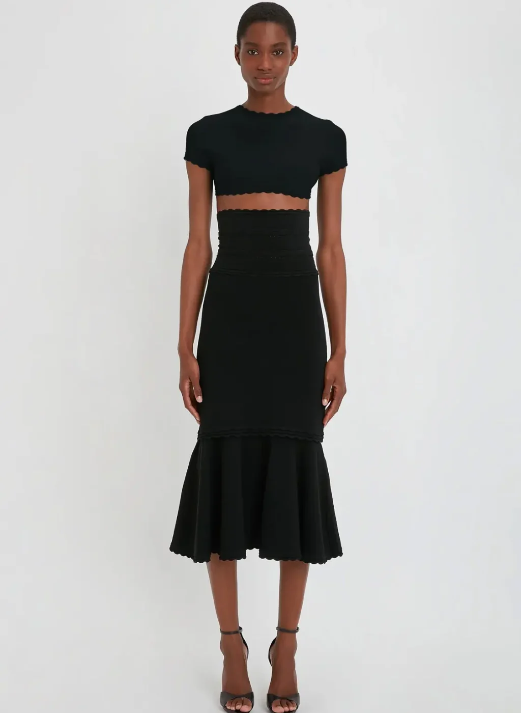 VictoriaBeckham_FlaredSkirtInBlack_BLACK_1223KSK004554A_2700_4050_247_WHITE_LR_HR_Front_Model1_JPG2_1500x-17.webp